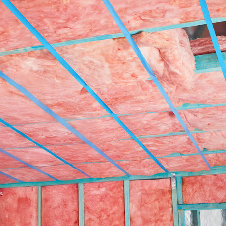 Pink insulation batts laid out for installation