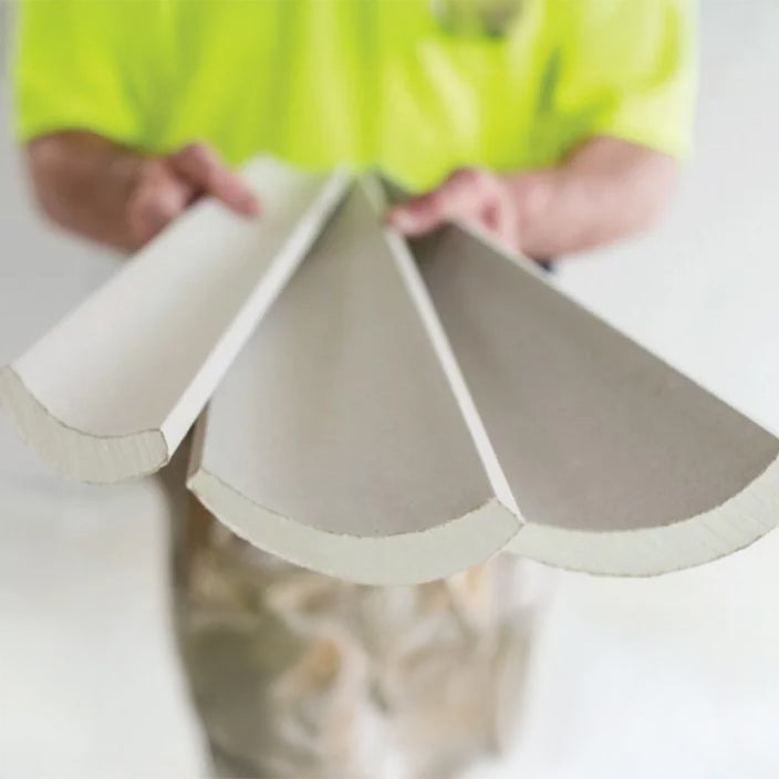 man holding three sizes of cove cornices